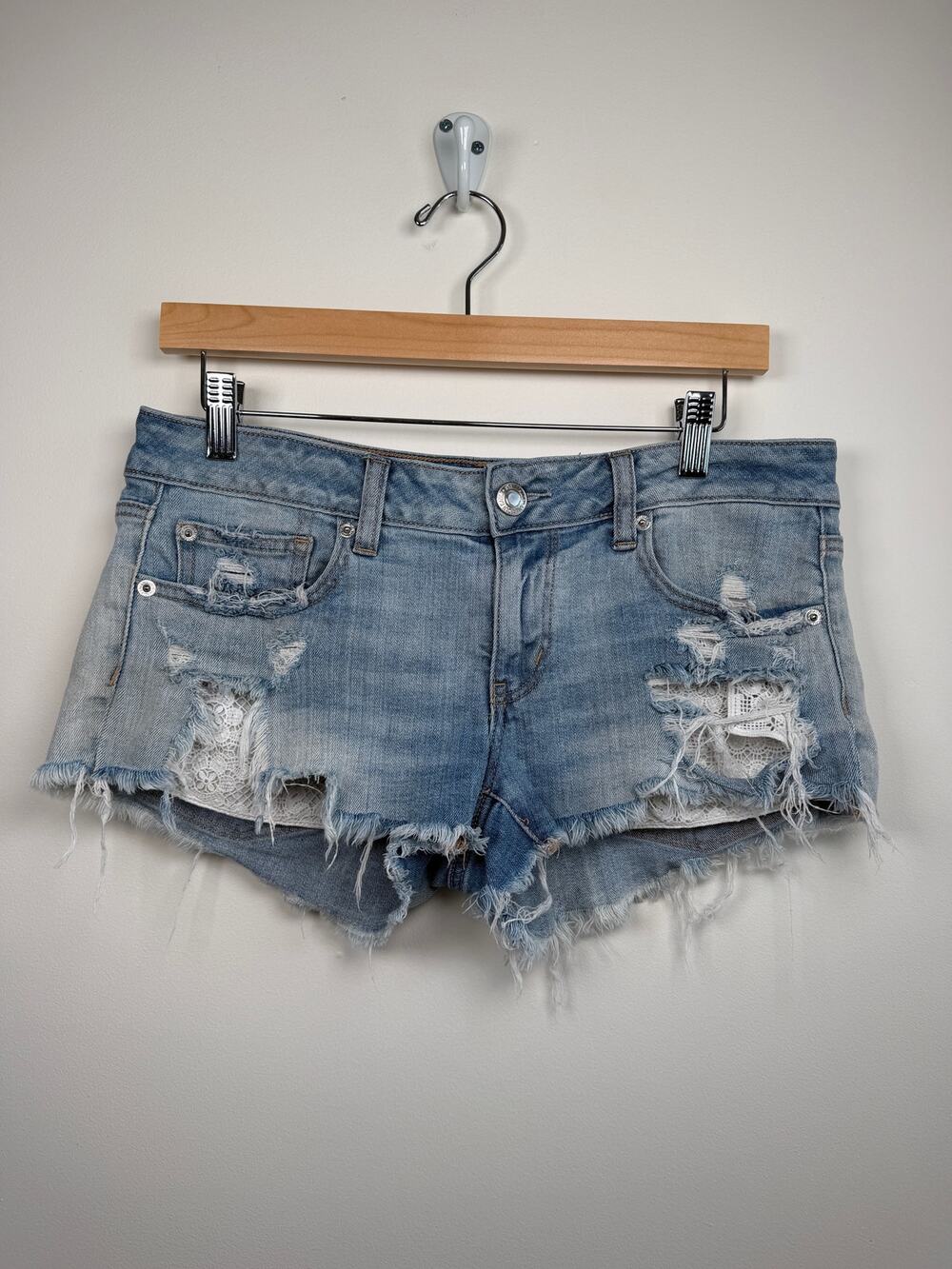 American Eagle Super Low Shortie Distressed Denim Lace Pocket Shorts Size 8 Blue